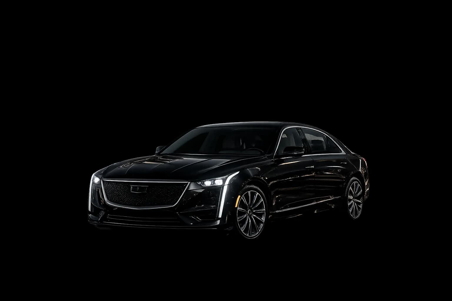 Black luxury sedan parked under golden light